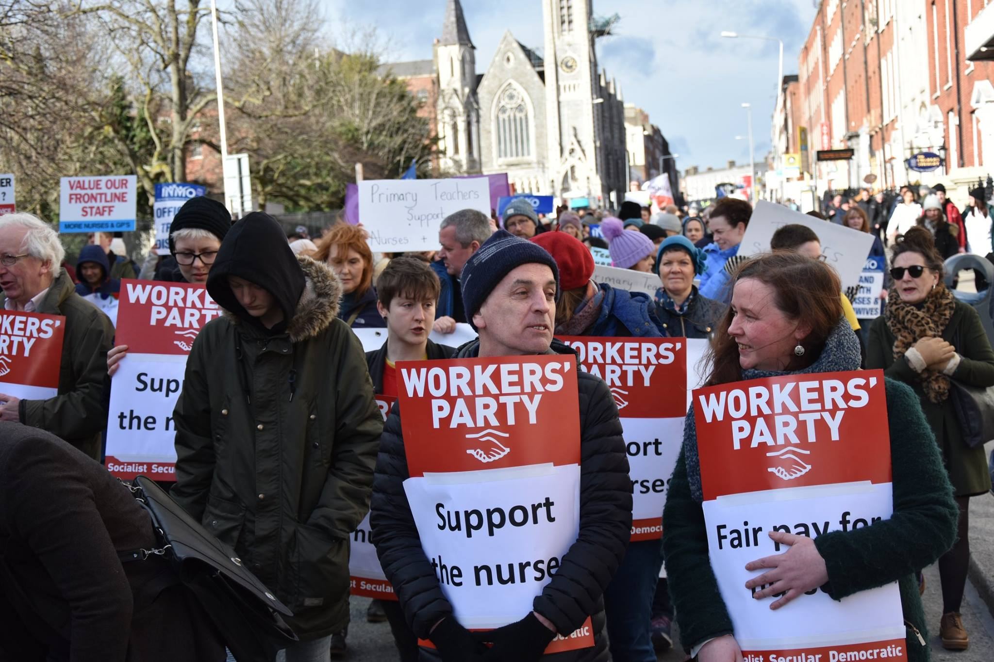 Workers' Party members supporting nurses at a public demonstration